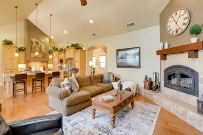 a living room with a couch and a fireplace at Furnished Decks and Grill Peaceful Pioneer Home! in Pioneer