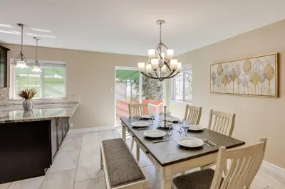 a dining room with a table and a fireplace at Gateway to Mt Rose Ski! Reno Home Near Casinos in Reno