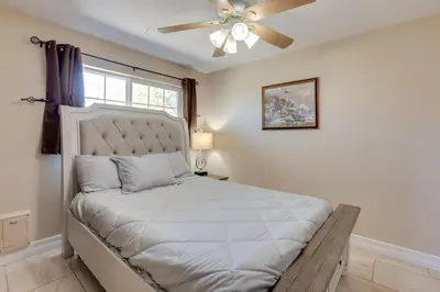 a bedroom with a bed with a ceiling fan at Gateway to Mt Rose Ski! Reno Home Near Casinos in Reno