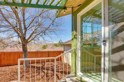 a glass door leading to a yard with a tree at Gateway to Mt Rose Ski! Reno Home Near Casinos in Reno