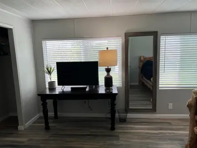 a room with a desk with a computer on it at The Sequoia guesthouse in Miramonte