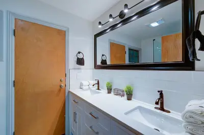 a bathroom with a sink and a mirror at The Cedar Tree in Fresno