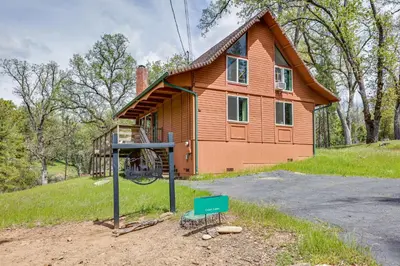 a house on a hill with a sign in front of it at Groveland Vacation Rental about 24 Mi to Yosemite! in Groveland