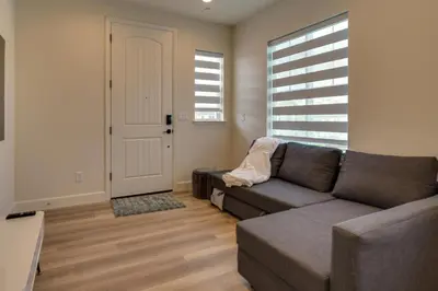 a living room with a couch and a window at California Midterm Rental with Fenced Yard! in Tracy