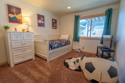 a childs bedroom with a bed and a window at Rr-johnson Suite 2 in June Lake