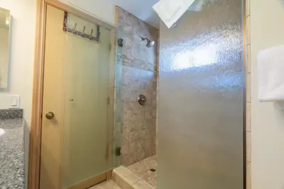a shower with a glass door in a bathroom at Rr-johnson Suite 2 in June Lake