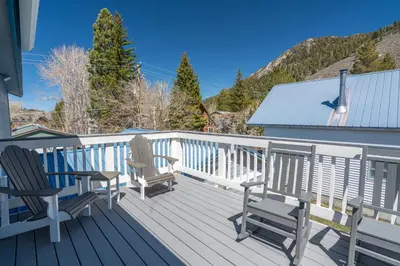 two chairs and a table on a deck at Rr-johnson Suite 2 in June Lake