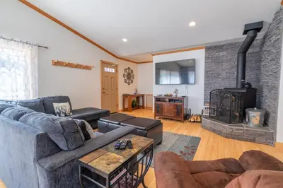 a living room with a couch and a fireplace at Rr-johnson Suite 2 in June Lake