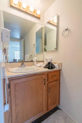 a bathroom with a sink and a mirror at Rr-interlaken 25 in June Lake