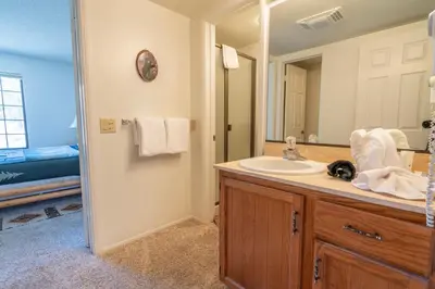 a bathroom with a sink and a mirror at Rr-interlaken 25 in June Lake