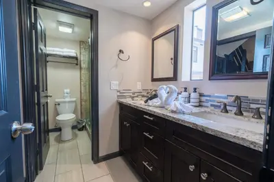 a bathroom with a sink and a toilet and a mirror at Rr-edgewater16 in June Lake
