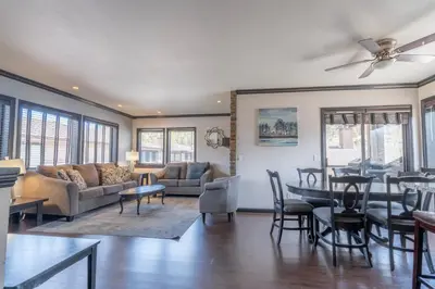 a living room with a table and a dining room at Rr-edgewater16 in June Lake