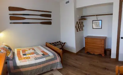 a bedroom with a bed and a dresser in it at Rr-edgewater09 in June Lake