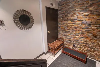 a room with a brick wall and a wooden staircase at Rr-edgewater20 in June Lake