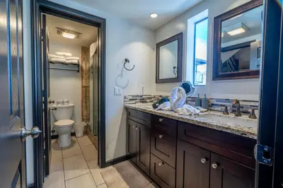 a bathroom with a sink and a toilet and a mirror at Rr-edgewater20 in June Lake
