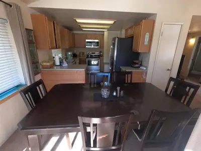 a kitchen with a large black table and chairs at Rr-edgewater13 in June Lake