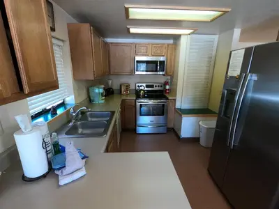 a kitchen with a sink and a refrigerator at Rr-edgewater13 in June Lake