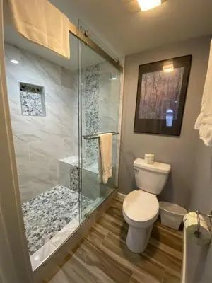 a bathroom with a toilet and a glass shower at Rr-edgewater17 in June Lake