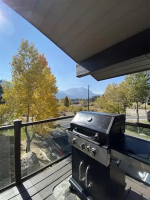 a grill on top of a deck with a view at Rr-edgewater17 in June Lake