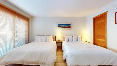two beds sitting next to each other in a bedroom at Snowcreek V #784 condo in Mammoth Lakes