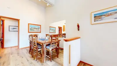 a dining room with a table and chairs at Snowcreek V #784 condo in Mammoth Lakes