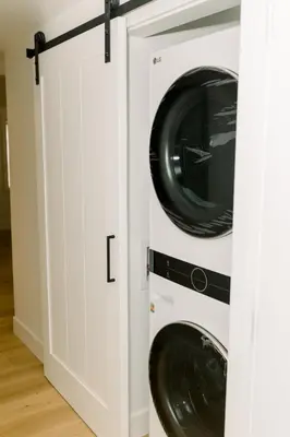 two washer and dryer cabinets in a laundry room at Casita- Lake Area Winter Special Ends 51626 in Bass Lake