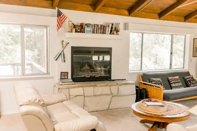 a living room with a couch and a fireplace at Moreno-Lake Area Free Night Special in Bass Lake