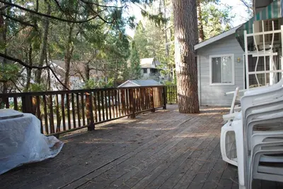 a wooden deck with a fence and a house at Cedar-Lake Area Winter Special Ends 51626 in Bass Lake