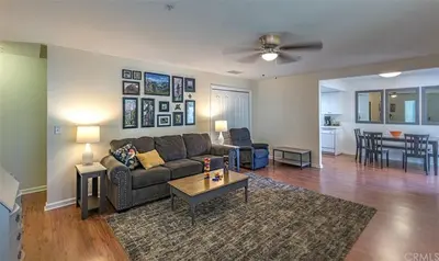 a living room with a couch and a table at Rosenberg Slide Creek Reduced Nightly Rate in Bass Lake