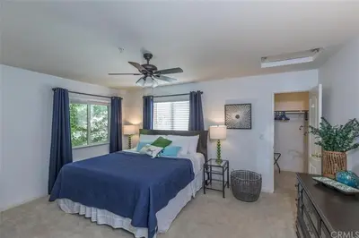a bedroom with a bed and a ceiling fan at Rosenberg Slide Creek Reduced Nightly Rate in Bass Lake