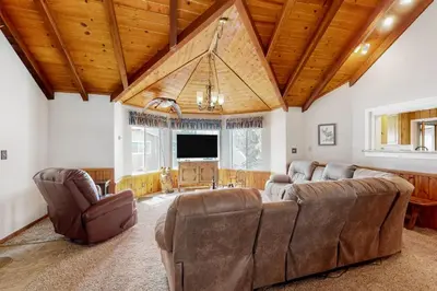 a living room with a couch and a tv at Wilts Happy Place in Bass Lake