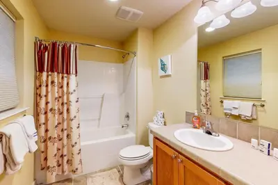a bathroom with a sink and a toilet and a shower at Charming Mt Rose Retreat in South Lake Tahoe