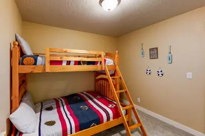 a bedroom with two bunk beds and a ladder at Charming Mt Rose Retreat in South Lake Tahoe