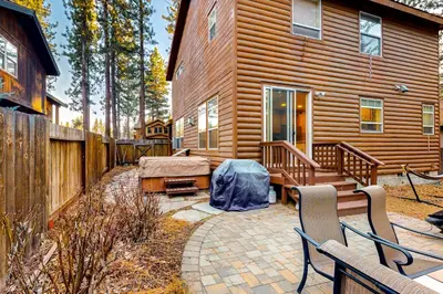 a backyard with a wooden cabin with a bench at Charming Mt Rose Retreat in South Lake Tahoe