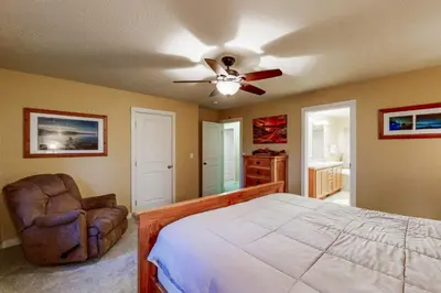a bedroom with a bed and a ceiling fan at Charming Mt Rose Retreat in South Lake Tahoe
