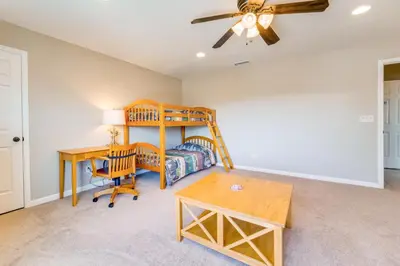 a room with a desk and a bed and a table at Furnished Deck and Gas Grill South Lake Tahoe Home! in South Lake Tahoe