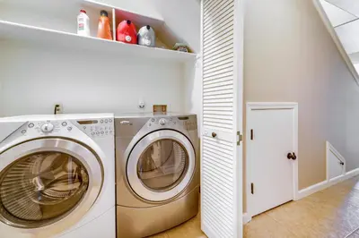 a laundry room with a washer and dryer at Furnished Deck and Gas Grill South Lake Tahoe Home! in South Lake Tahoe