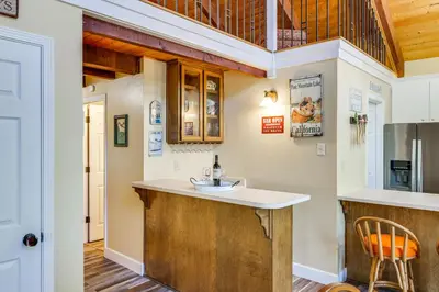 a kitchen with a sink and a counter top at Groveland Home - Walk to Pine Mountain Lake! in Groveland
