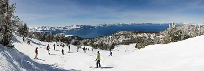 a group of people skiing down a snow covered slope at 3BR Mountain Cabin-Near Beach & Slopes in Homewood