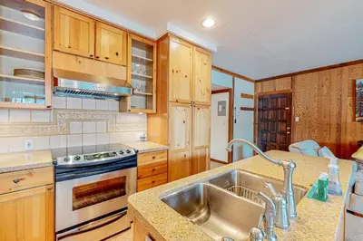 a kitchen with a sink and a stove at Mountain Time Escape in Olympic Valley