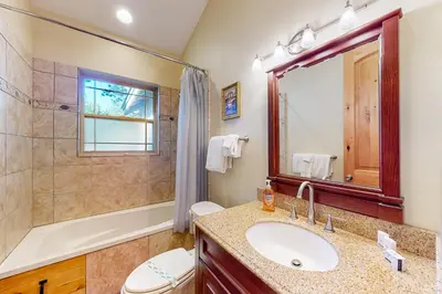 a bathroom with a sink and a shower and a toilet at Heavenly Lake Hideaway in South Lake Tahoe