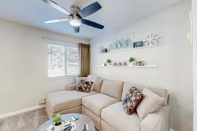 a living room with a couch and a ceiling fan at Tranquil Haven Retreat - DSTR1068 in Stateline