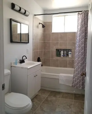 a bathroom with a tub and a toilet and a sink at Lake Isabella View, Wofford Heights, Kern County in Wofford Heights