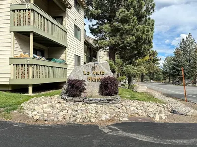 a rock with the words be use blazes on it in front of a house at La Vista Blanc #16 condo in Mammoth Lakes