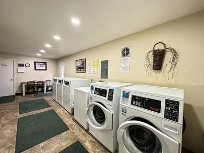 a laundry room with three washing machines in it at La Vista Blanc #16 condo in Mammoth Lakes