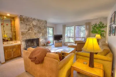 a living room with two couches and a fireplace at Ski Lake Lodge home in Incline Village