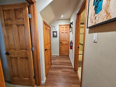 a hallway with wooden floors and wooden doors at Cozy Bear Lodge home in Incline Village