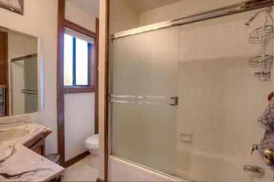 a bathroom with a shower and a toilet at Inclining View home in Incline Village