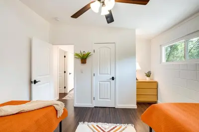 a bedroom with two beds and a ceiling fan at Modern Meadow Vista Vacation Home with Spacious Deck in Meadow Vista