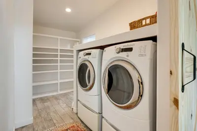 a laundry room with a washer and dryer at Modern Meadow Vista Vacation Home with Spacious Deck in Meadow Vista